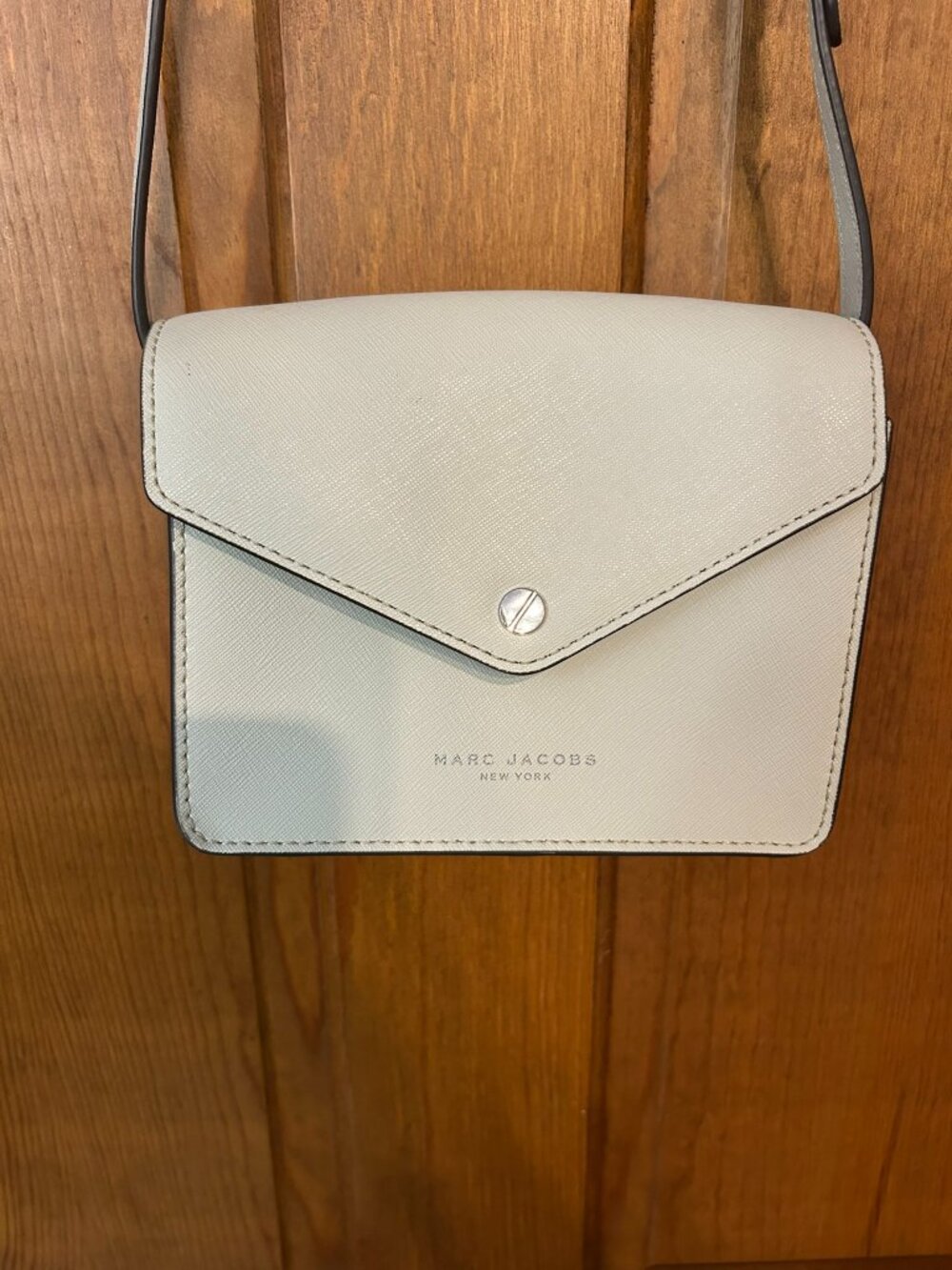 Marc Jacobs purse, creamy ecru, lang strap with snap closure